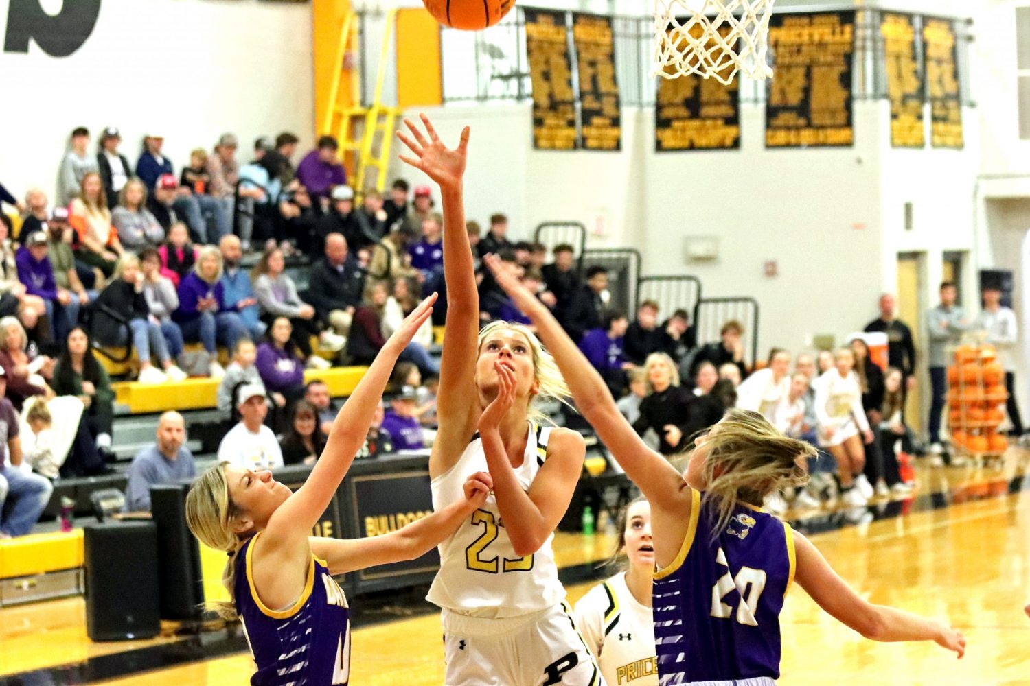 Abby Langlois shoots over a Danville defender in a game earlier this season. Enquirer photo by Jim Meadows