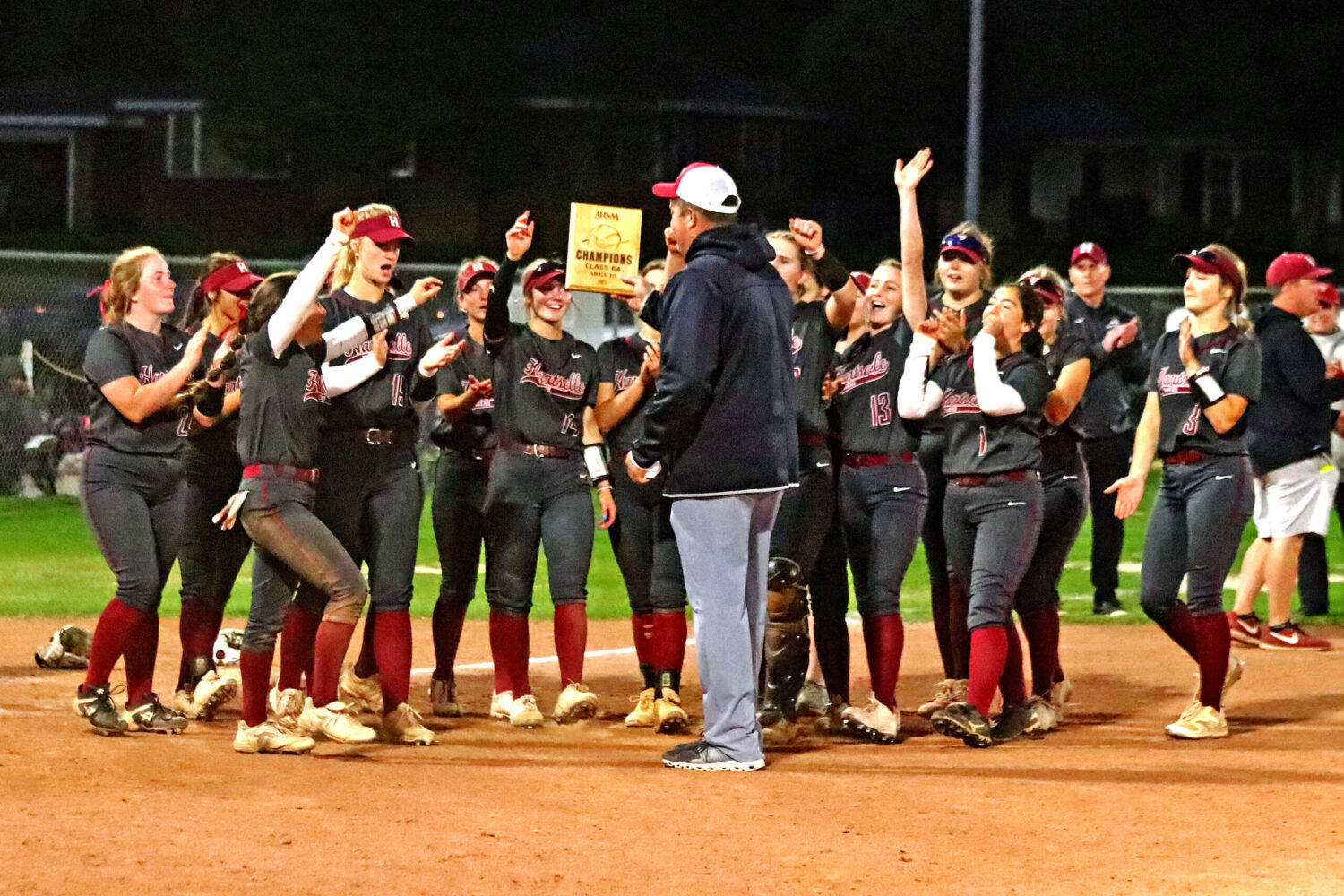 The Hartselle Tigers are awarded the Area Championship plaque by Hartselle Athletic Director Pat Smith after they defeated Muscle Shoals 4-1 in the championship game. Photo by Jim Meadows