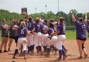 The Danville Lady Hawks mob their coach, Christy Ferguson, after winning the 3A North Regional after a 7-5 over Mars Hill. Photo by Bridgette Guest