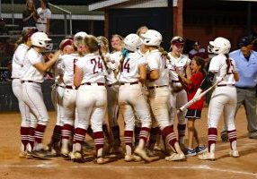 Hartselle players celebrate Katie Norgard’s second home run of the game, a three-run shot that gave the Tigers an 11-10 lead in the bottom of the sixth inning of the Tigers’ 13-10 victory over Athens. Photo by Jim Meadows 